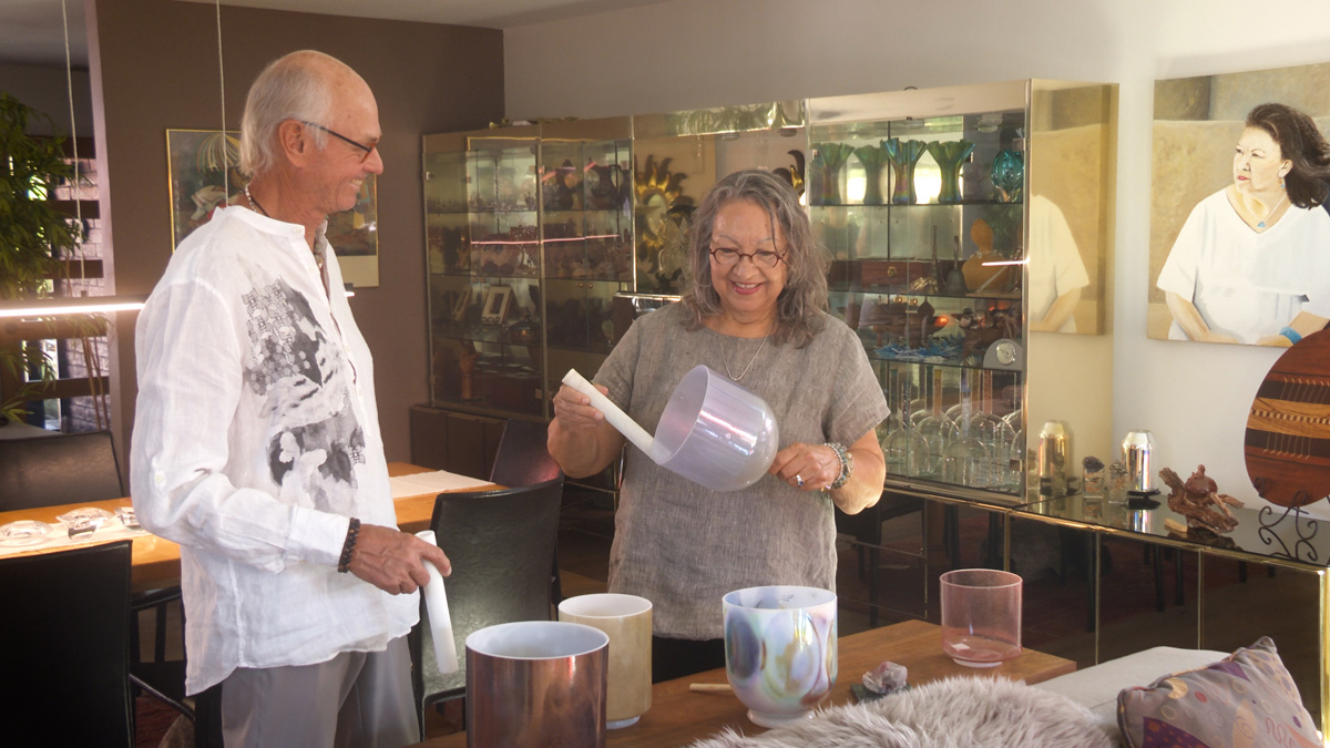 Happy couple enjoying singing bowls at home