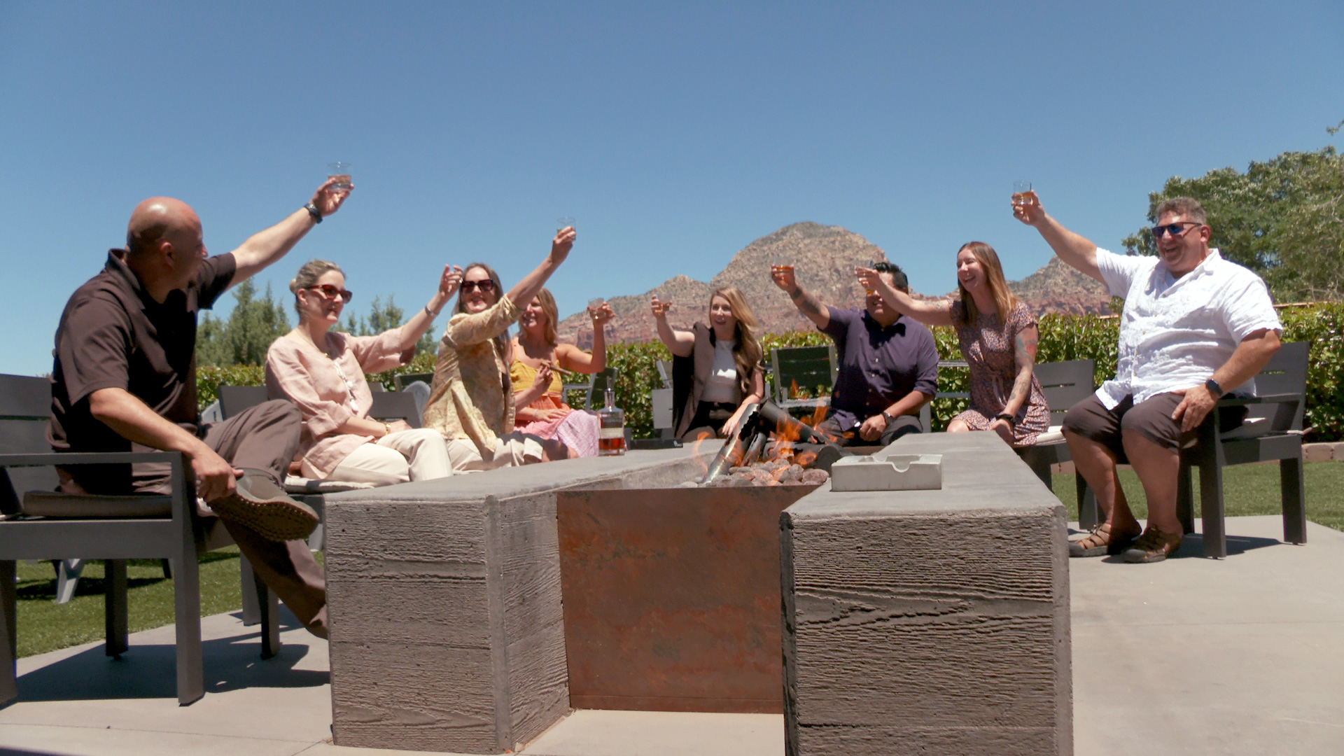 Group of friends toasting at Redwall Distillery in Sedona, Arizona